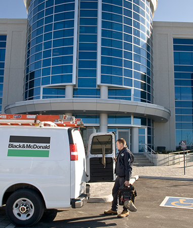 Electrical service technician at a client site after a service call.