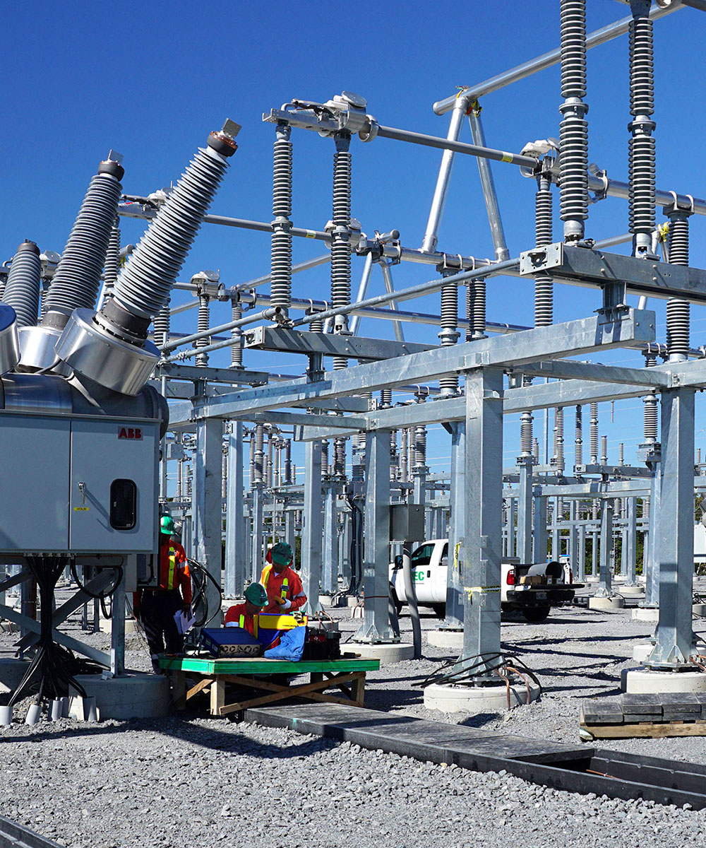 Utility workers constructing a substation.